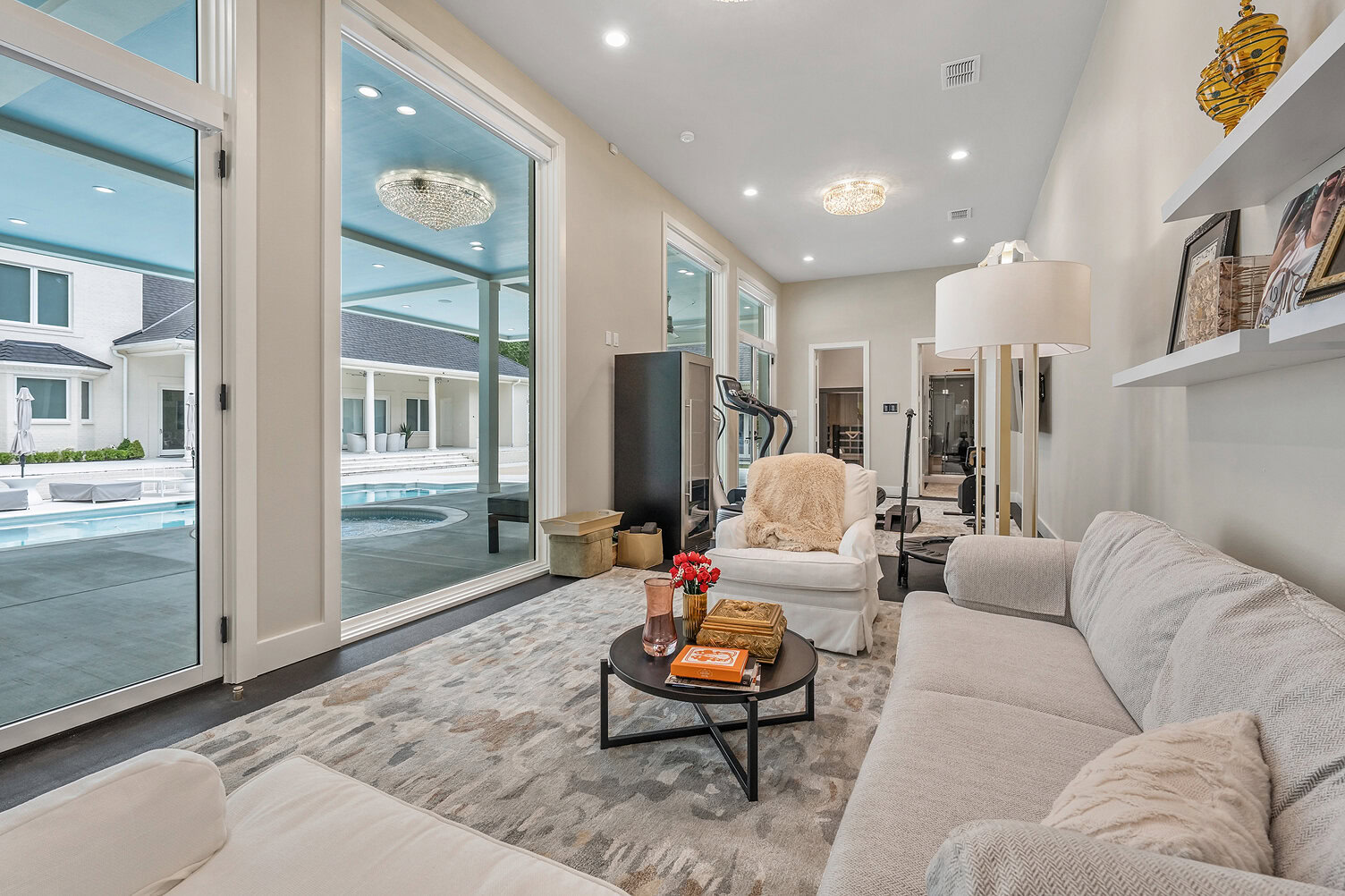 Bright living room with large windows and cozy furniture at The Thornwood.