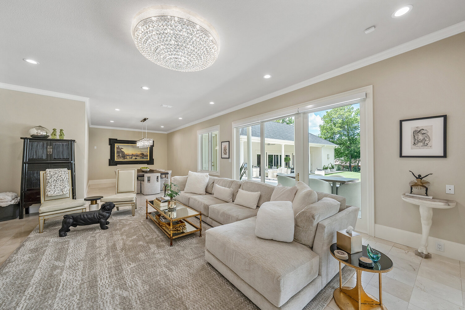 Bright and airy living room with large windows and elegant decor.