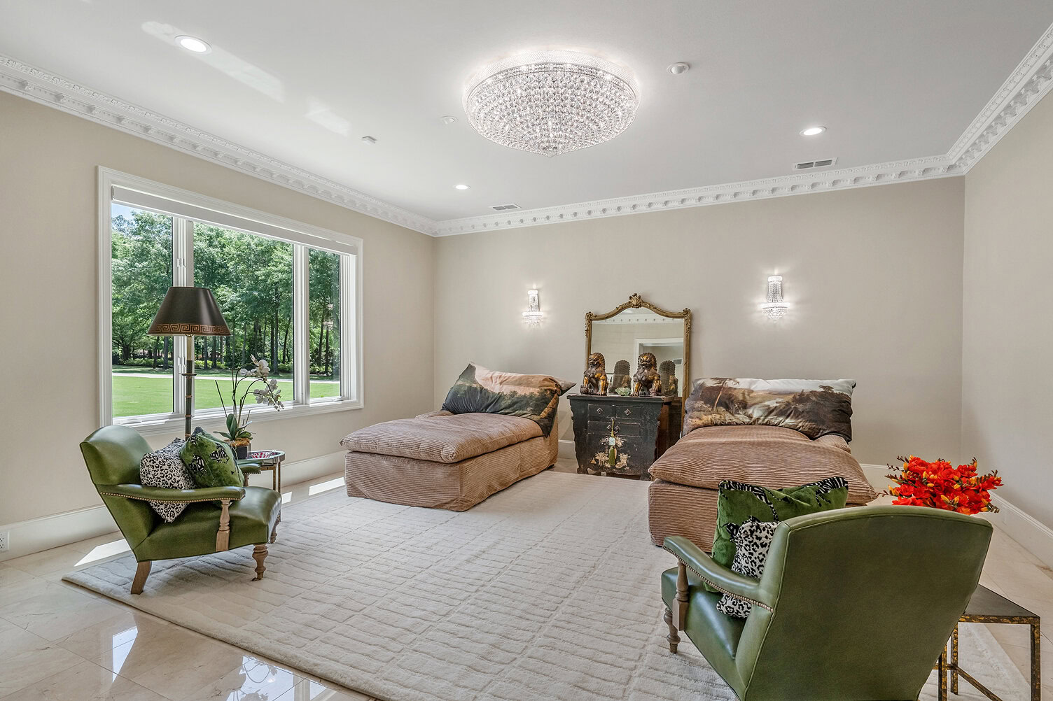 Spacious bedroom with two beds, large window, and stylish decor.
