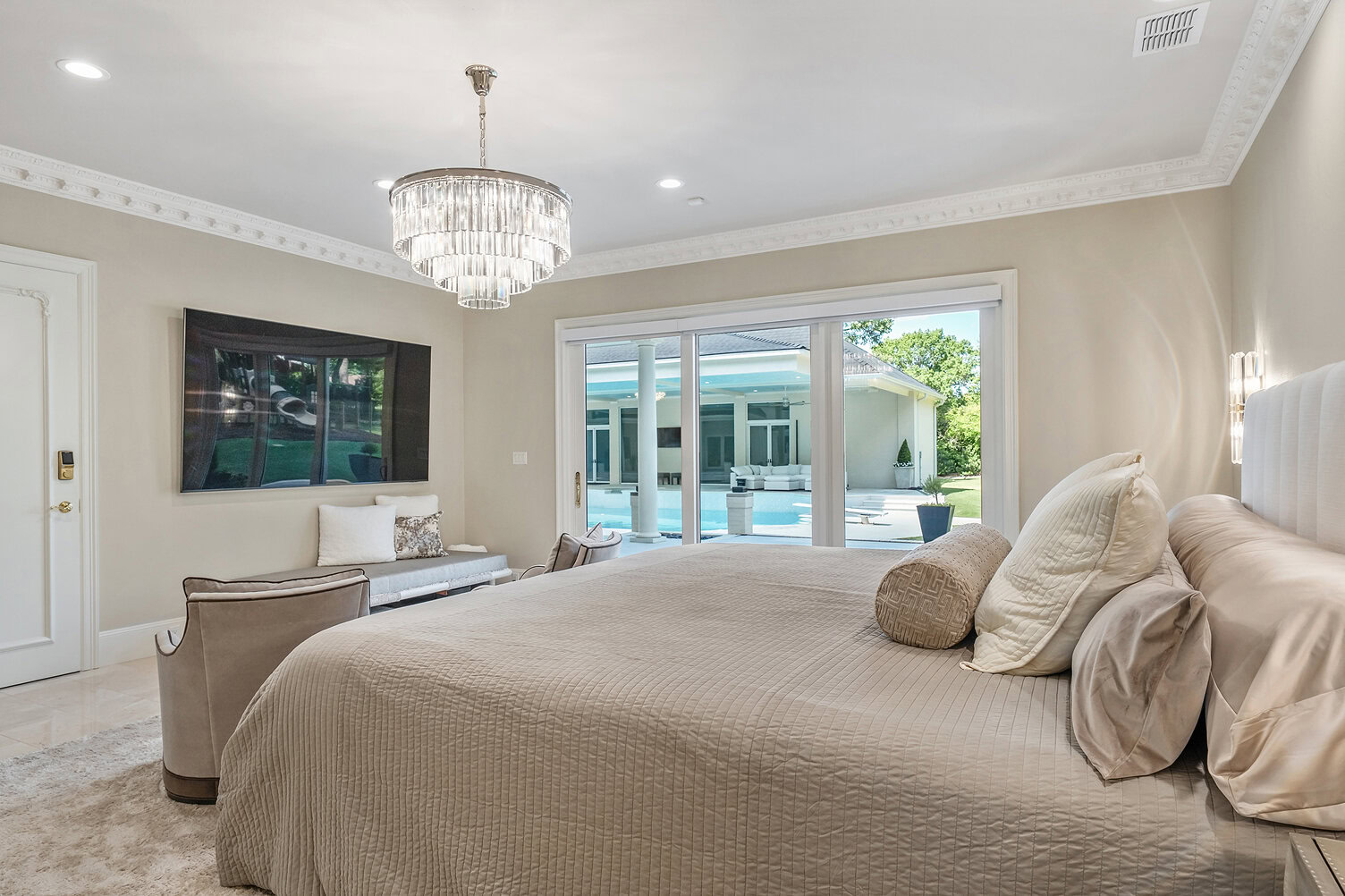 Elegant bedroom with large window overlooking pool at The Thornwood.